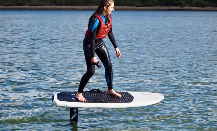 Girl riding efoil in anglesey